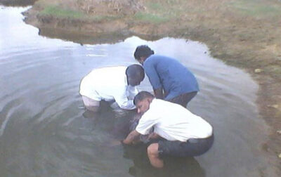 Bro. Bose and Two Brothers Baptize a Student